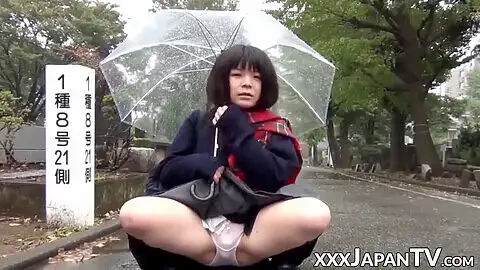adorable japanese woman has vibrator pleasing her in the rain